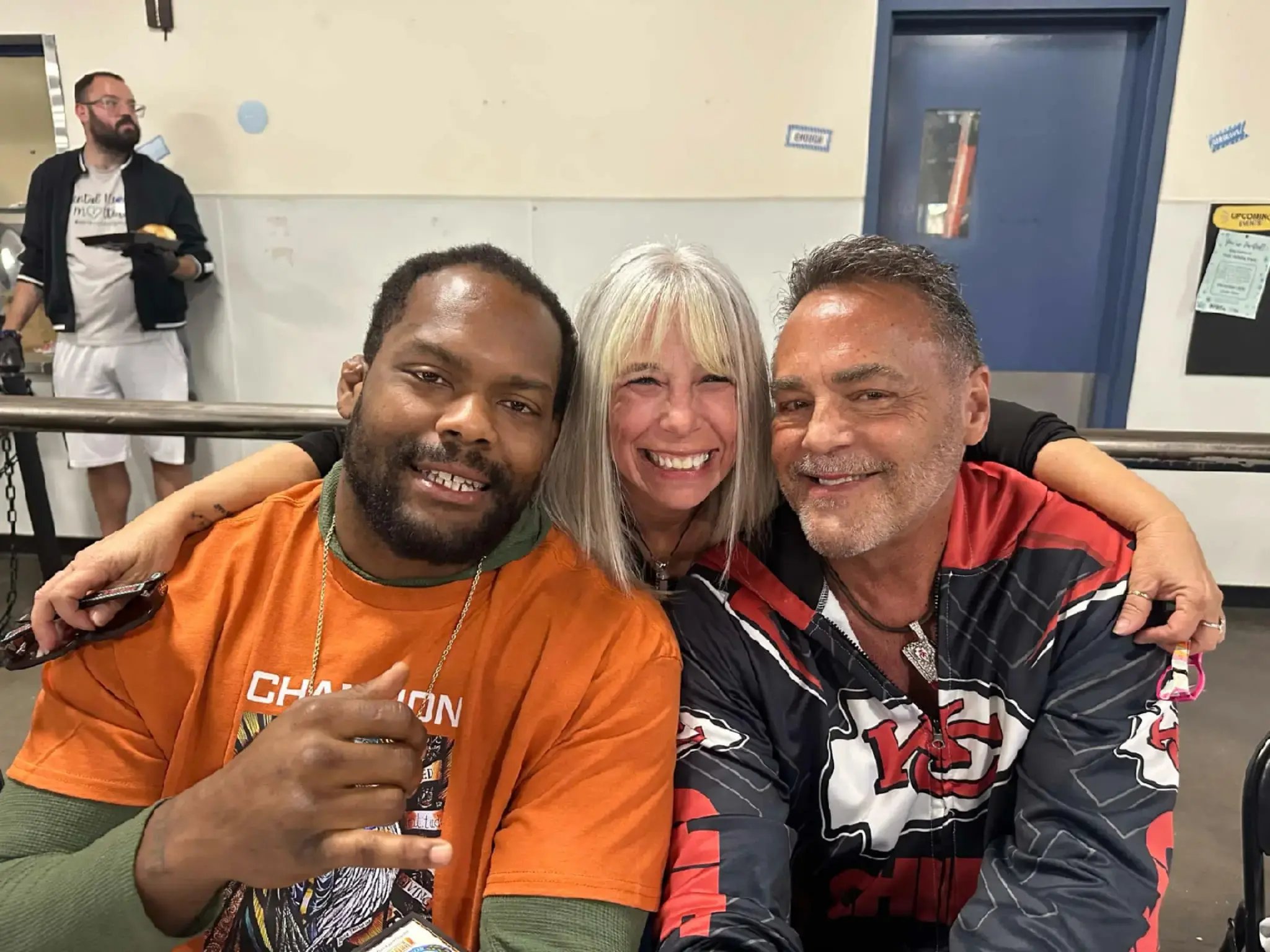Angel Prater with Nick Lowery and a fellow guest at a Champions for the Homeless event