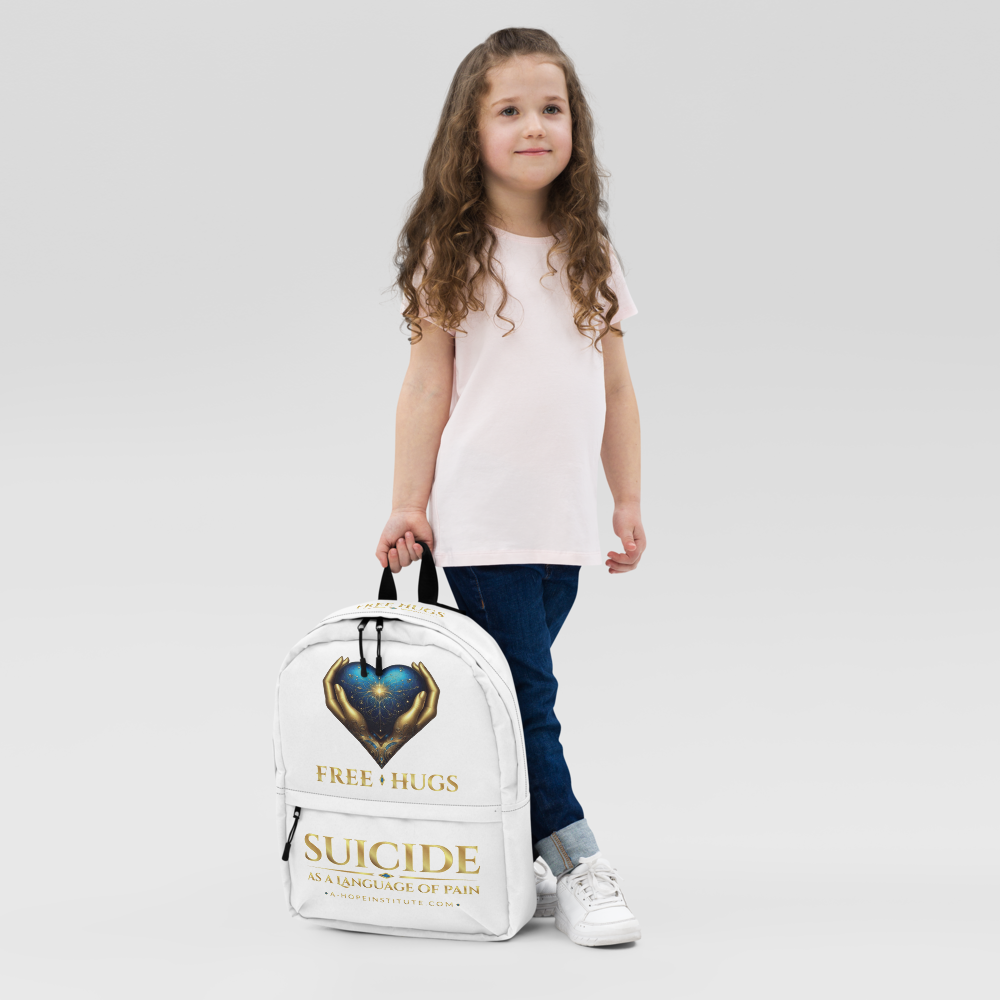 Young girl holding the white FREE HUGS backpack by its handle