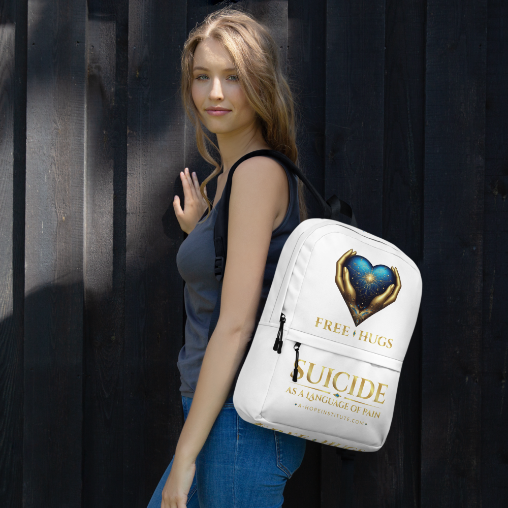 Young woman wearing the white FREE HUGS backpack against a dark wood wall