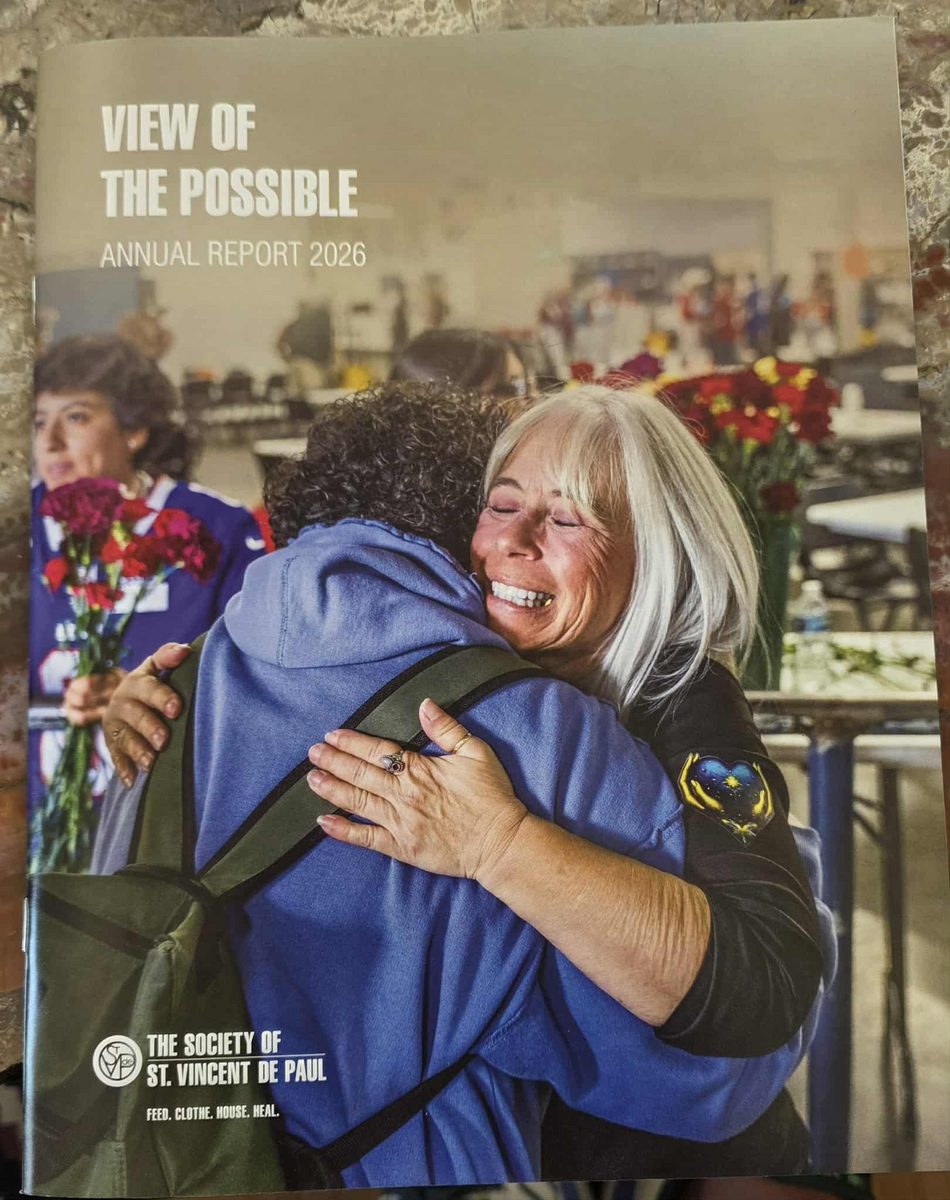 Cover of the Society of St. Vincent de Paul View of the Possible Annual Report 2026, showing Angel hugging a community member